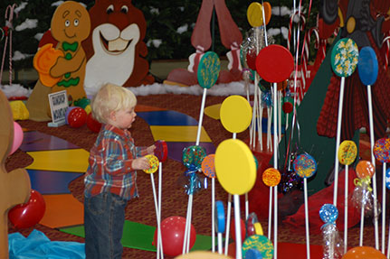 Little Boy Playing with Large Lolly Pops